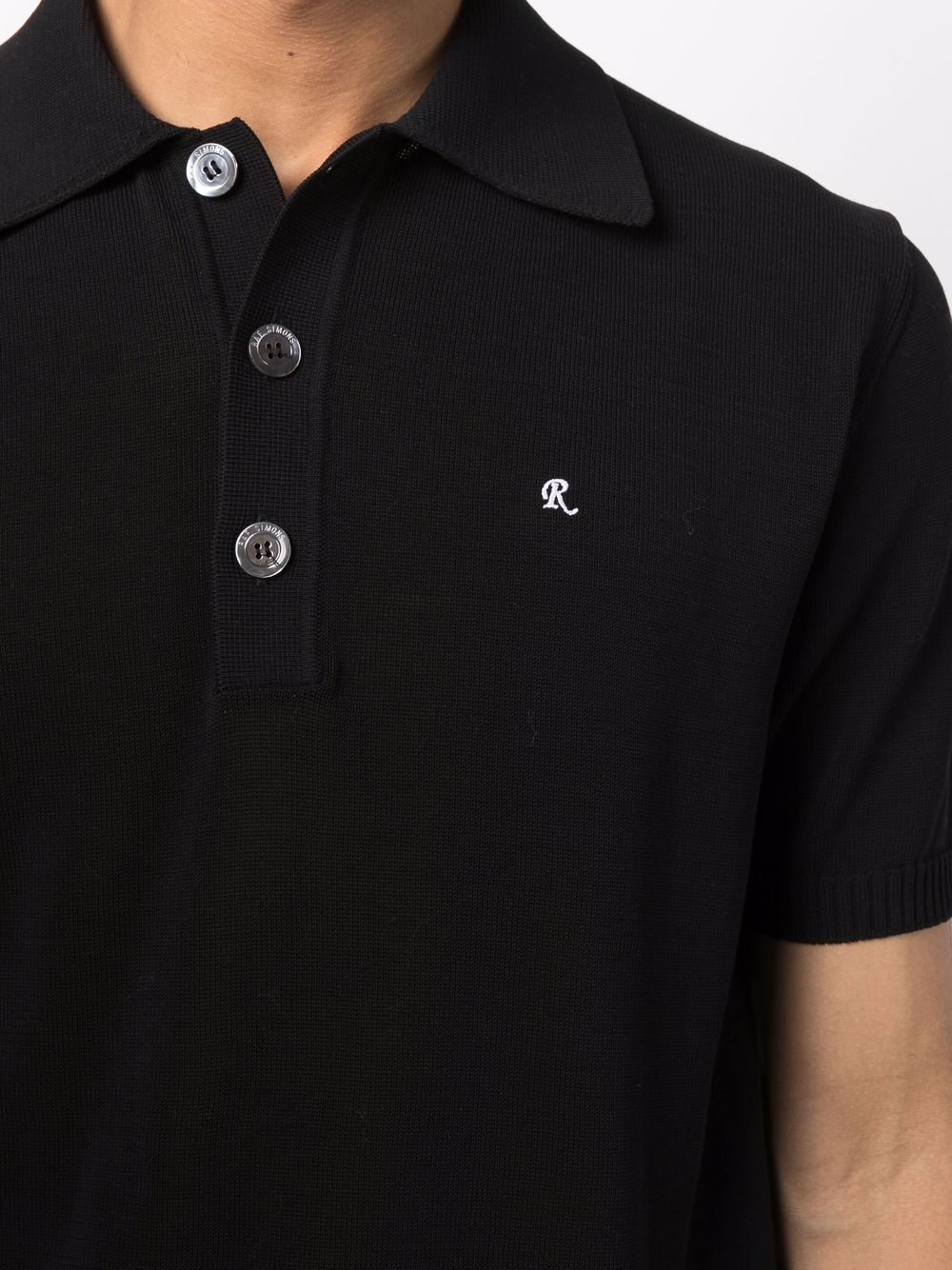 Polo nera in maglia di cotone cotone