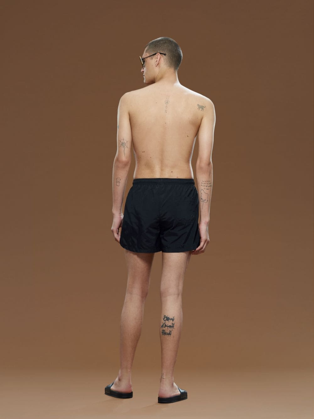 Black knee-length swimming shorts