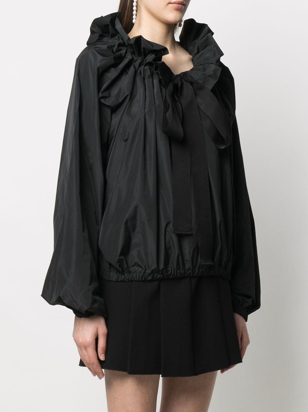 Black ruffle-trimmed blouse