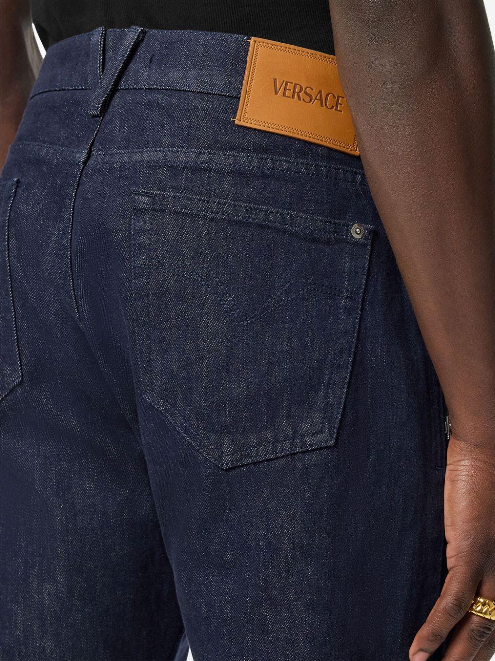 Logo-patch jeans<BR/><BR/><BR/> 1015844 1A124771D100 VERSACE 