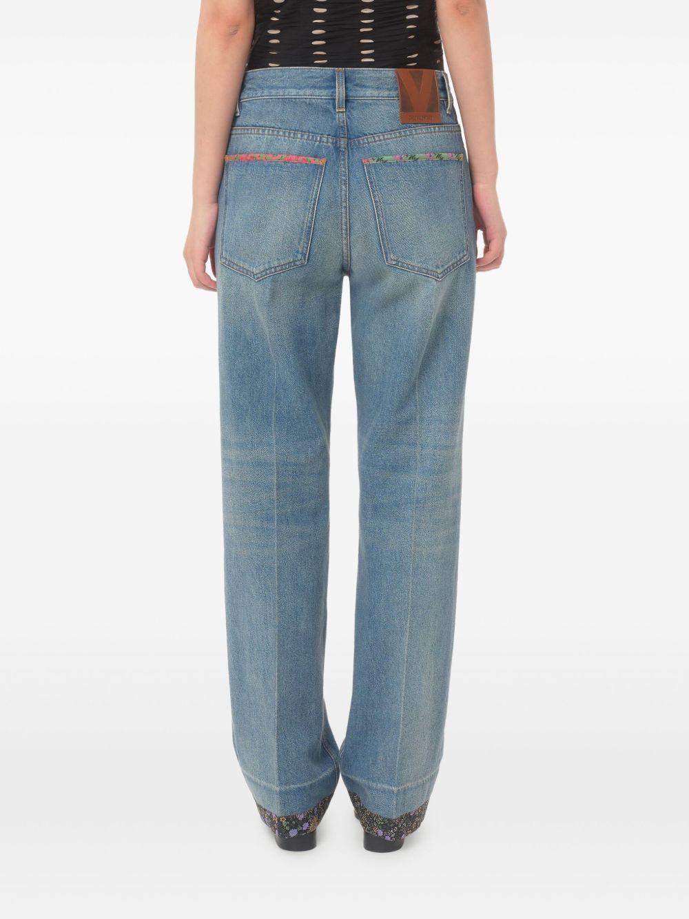 Wide-leg jeans crafted with floral print fabric trim 6B0DD19X94V 558 VALENTINO GARAVANI 