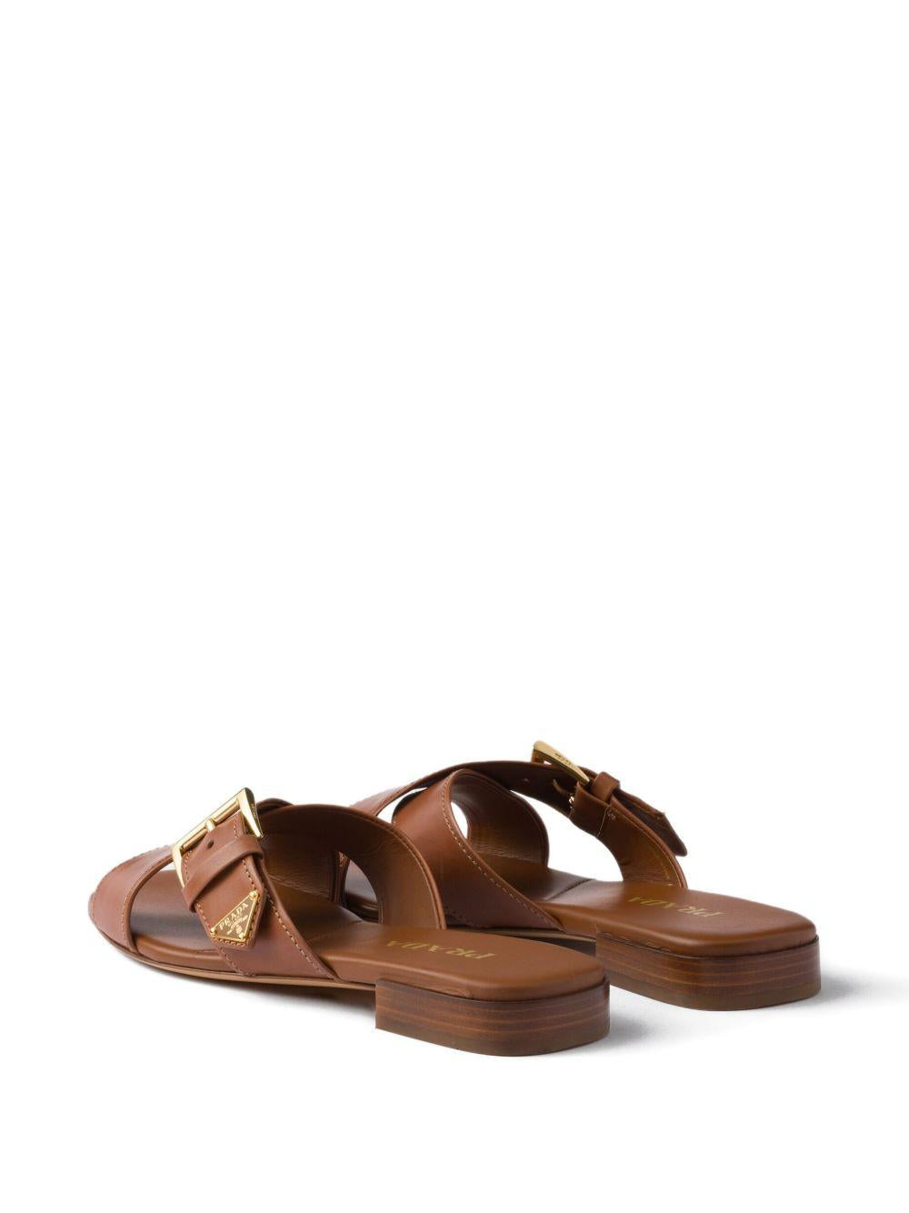 Leather crisscross slides with buckle 1XX778248 F-010F0054 PRADA 