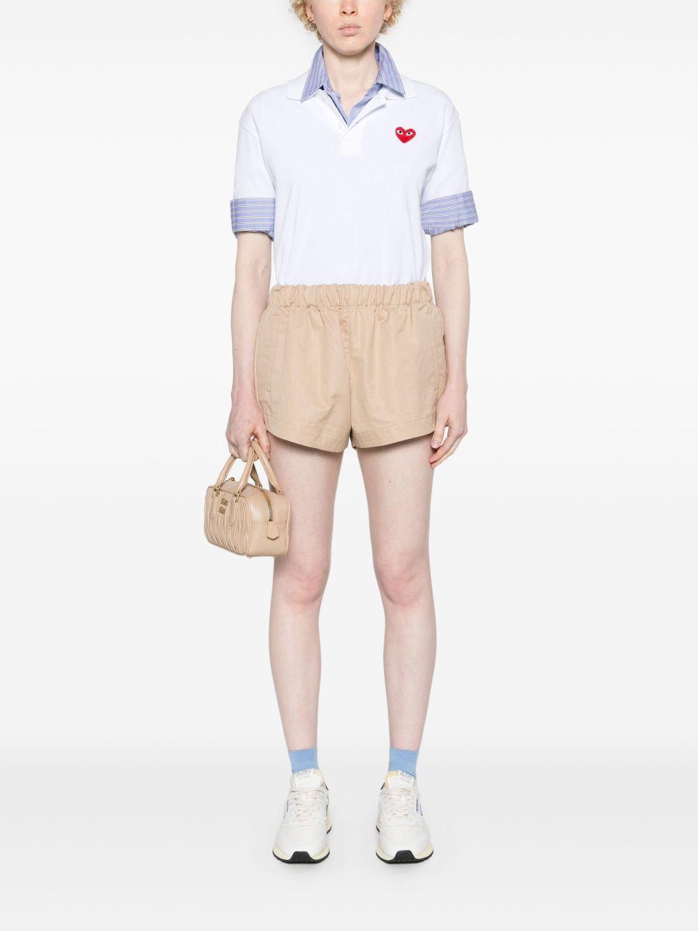 Logo Heart Polo T-shirt AX-T006-051 WHITE COMME DES GARÇONS PLAY 